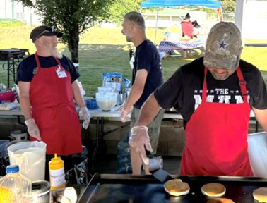 Firefighters making breakfast in the Placerville Plaza